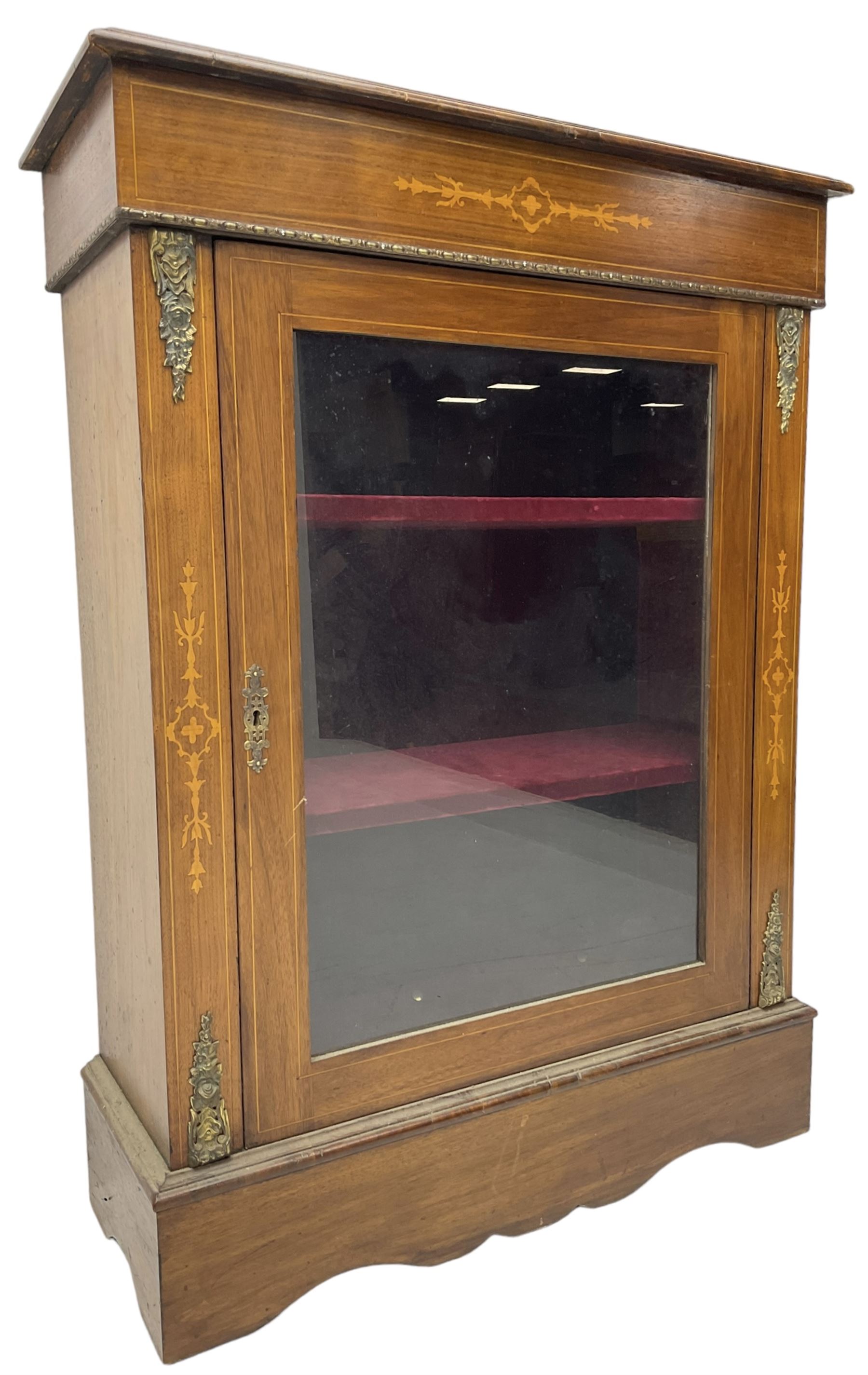 Victorian walnut pier cabinet, moulded rectangular top over inlaid frieze, decorated with gilt metal mounts and beading, the glazed single door flanked by inlaid uprights, on moulded plinth base