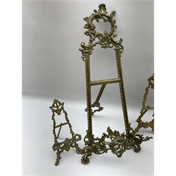 Collection of ornate brass easel picture stands, largest example H51cm