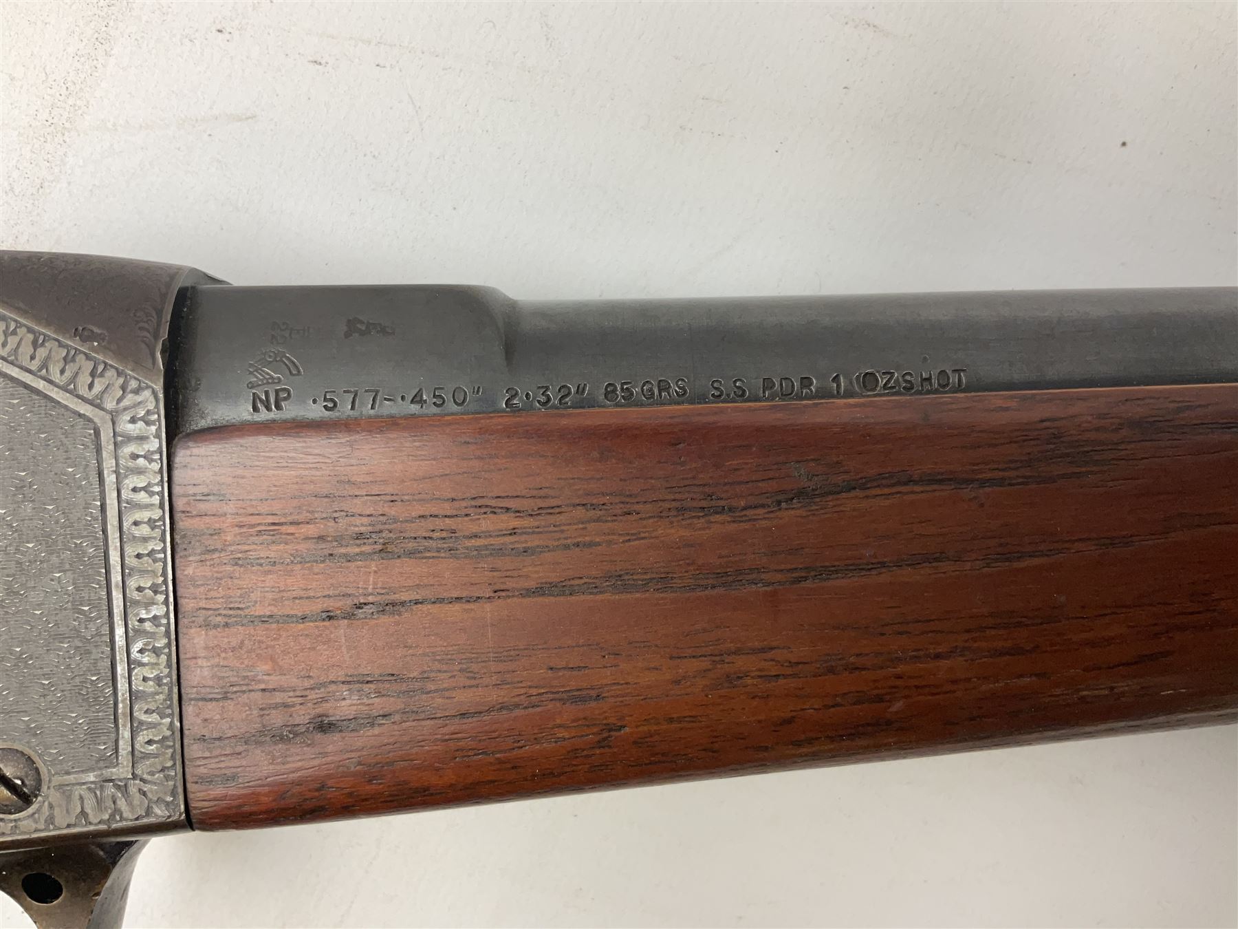 Manton .577/450 Martini Henry rifle, the 82.5cm smooth bored barrel proofed for shot, two barrel bands and bayonet fitting, engraved action with side safety, figured walnut stock with chequered steel butt plate, complete with ramrod, NVN other than 5346 on barrel, L125cm