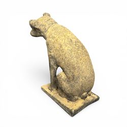 Cast stone garden statue in the form of a seated Jack Russell Terrier on a rectangular base