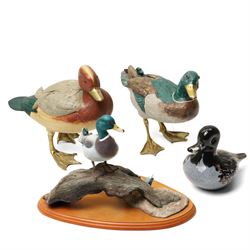 Four various duck ornaments, including a Langham glass duck, Border Fine Arts Mallard, and...