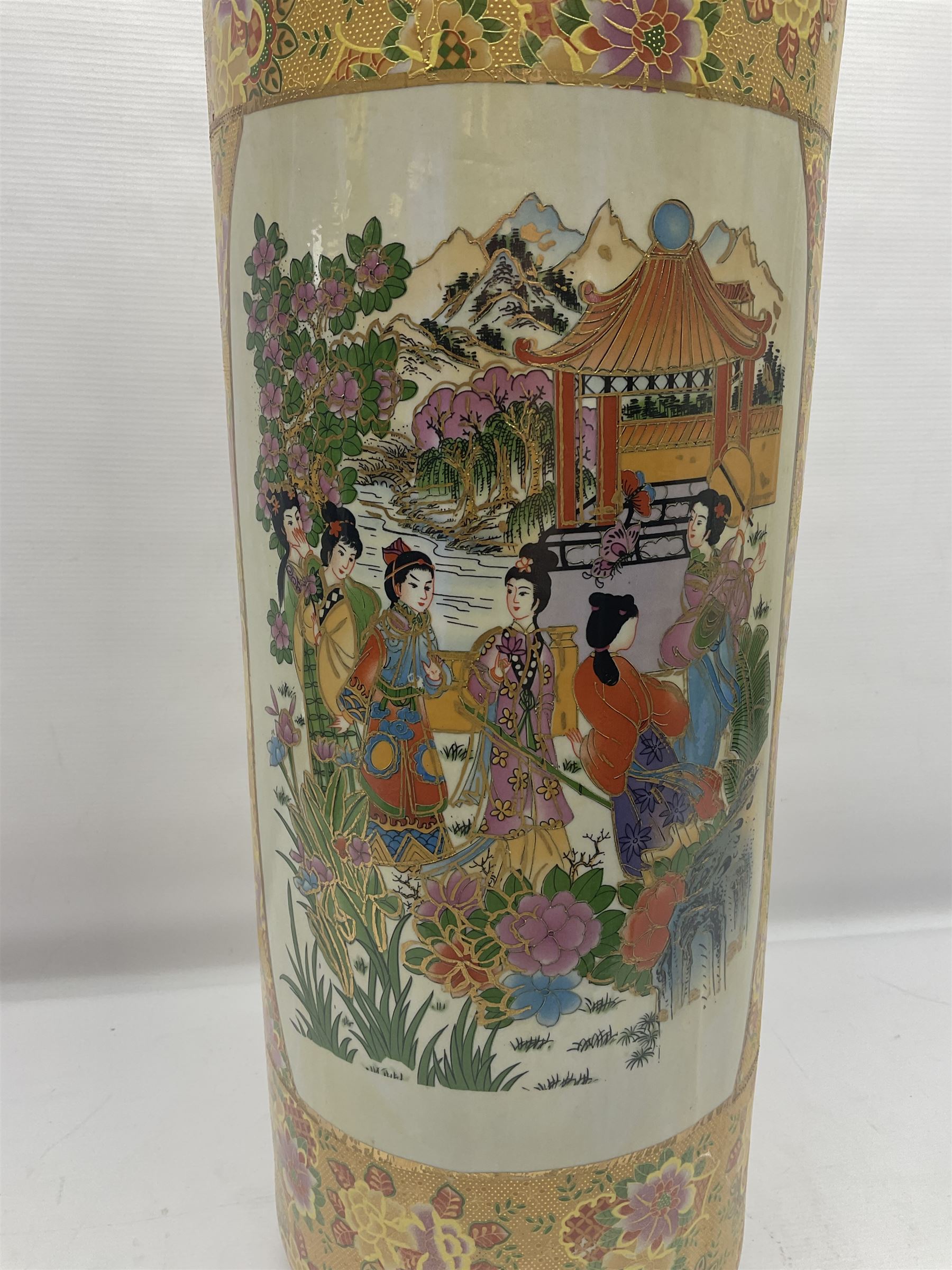 Modern Japanese ceramic umbrella stand, decorated with a figural panel on a yellow floral ground, H60cm