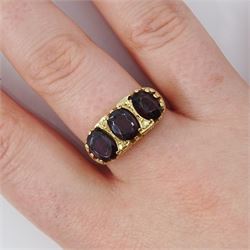 9ct gold ring, set with three oval cut garnets, London 1971