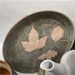 Wold studio pottery tankards, in various colours and relief decoration together with other studio items including vases, jugs and pots 