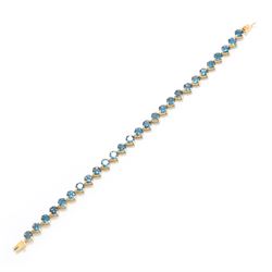 9ct gold London blue topaz bracelet, set with twenty-seven round cut topaz's, Birmingham 2006