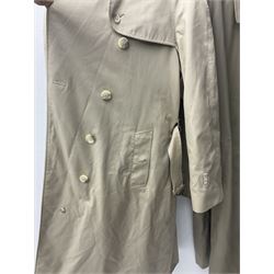 Ladies Burberry double breasted trench coat, with belt and detachable woollen gilet, in traditional cream colour with Burberry check lining, together with a gentlemans Burberry single breasted trench coat, both L112cm