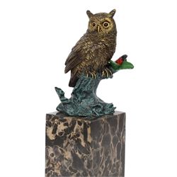 Cold painted bronze figure, modelled as an owl perched upon a tree stump signed Milo and with foundry mark, raised upon black veined marble plinth, H27.5cm