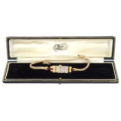 9ct gold calibre cut ruby and single cut diamond manual wind watch, case makers mark DS & S (possibly David Sutton & Sons), London 1946 on 9ct gold strap, in fitted velvet and silk lined case by Reids of Newcastle