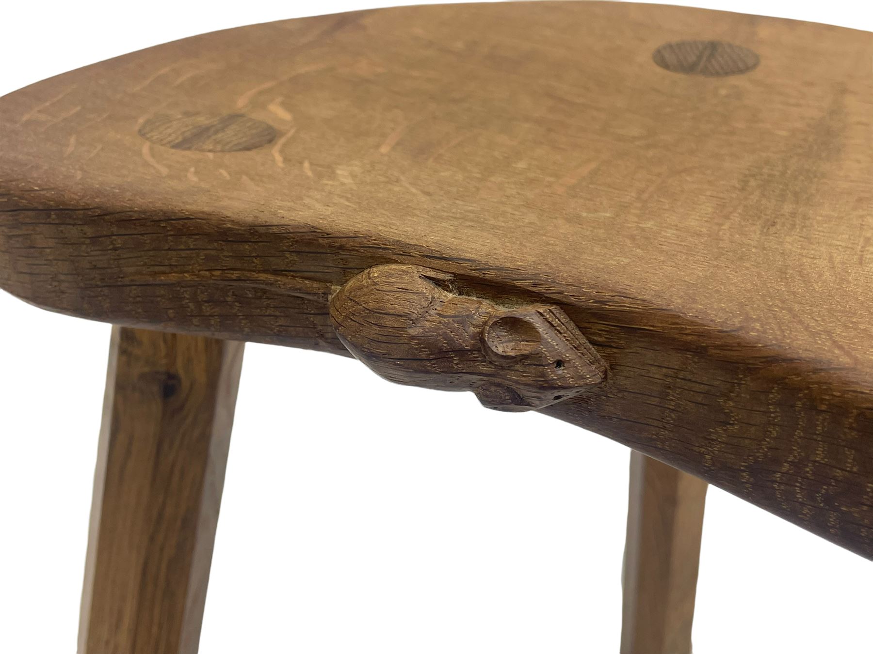 'Mouseman' oak three-legged stool, kidney shaped dished seat carved with mouse signature to edge, by Robert Thomas of Kilburn