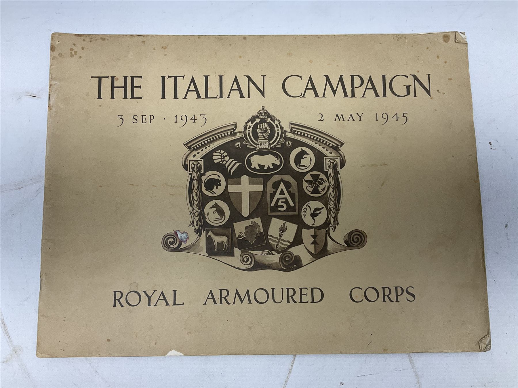 Modern album containing over sixty postcards and photographs including memorial portraits of KIA soldiers, regimental crests, comic, WW1 embroidered silk, uniforms, cap badges, camp and manoeuvre images etc; another personal photograph album of WW2 soldiers relaxing; Royal Armoured Corps booklet 'The Italian Campaign 3rd Sep. 1943 - 2nd May 1945; and other paper ephemera of military interest