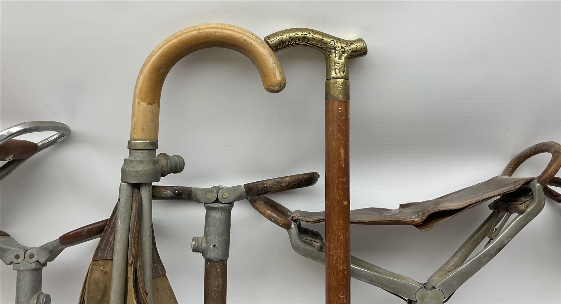 Adjustable Gamebird shooting stick, together with Mills Munitions shooting stick, Featherwate shooting stick, five others and two wooden walking sticks.  