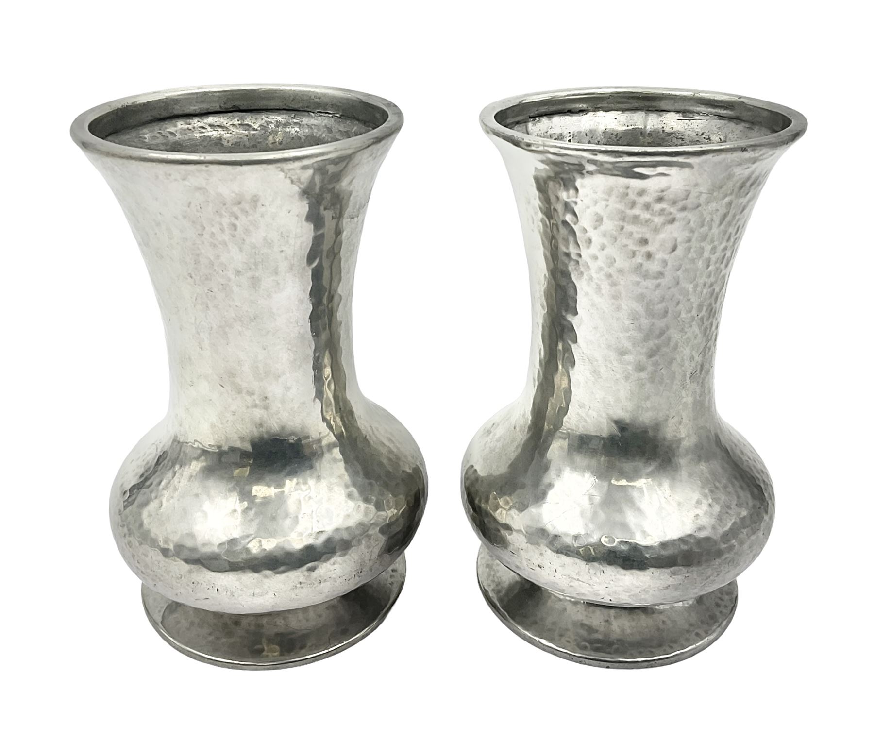 Pair of Liberty & Co Tudric pewter vases, each of bellied form with hammered finish, upon a circular spreading foot, impressed beneath 0987, H12cm