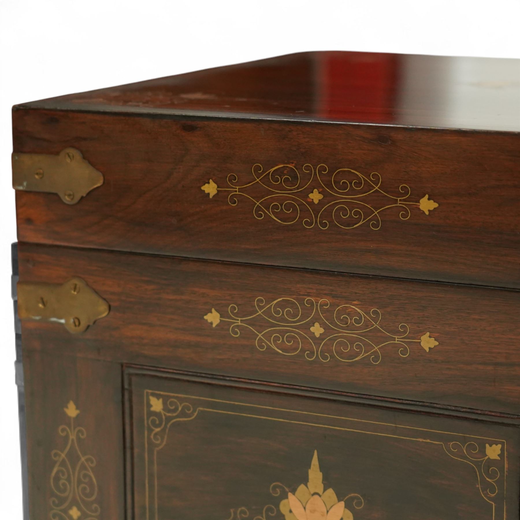 Pair of late 19th century colonial hardwood and brass inlaid chests, each rectangular with hinged top and brass strapping, floral and urn pattern inlay to the panels, with pierced brass side handles, fitted baize-lined butlers tray