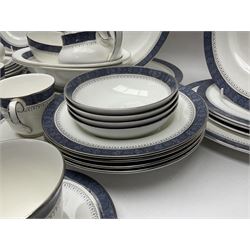 Royal Doulton Sherbrooke pattern dinner service, comprising two oval serving platters, two oval serving dishes, five dinner plates, six dessert plates, two side plates, six soup bowls, four smaller bowls, one large saucer, six smaller saucers, six teacups, open sucrier, milk jug, and cream jug