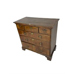 18th century walnut straight-front chest, rectangular crossbanded top, fitted with three short over three long graduating drawers, each with feather banded facias, lower moulded edge over bracket feet