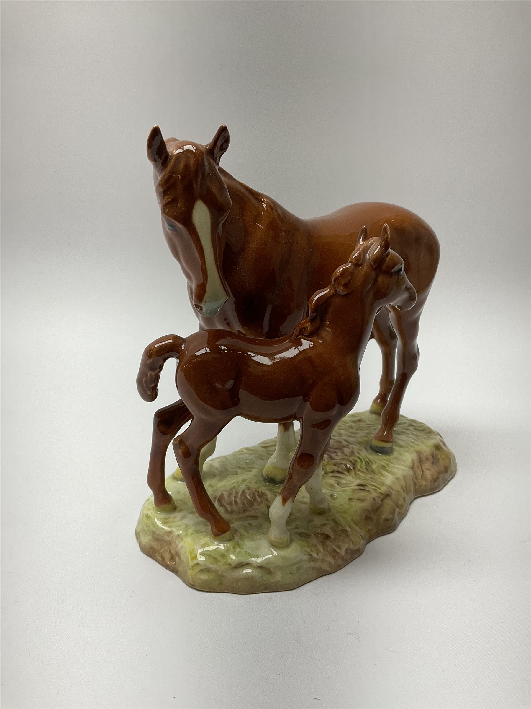 A Beswick model of a chestnut mare and foal on naturalistic base, 2nd version model no 953, with printed mark beneath, H19.5cm. 