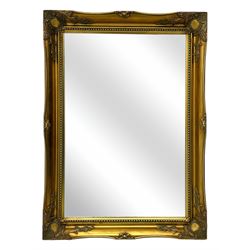 Early 20th century wall mirror, the rectangular frame with swept corners and applied scrol...