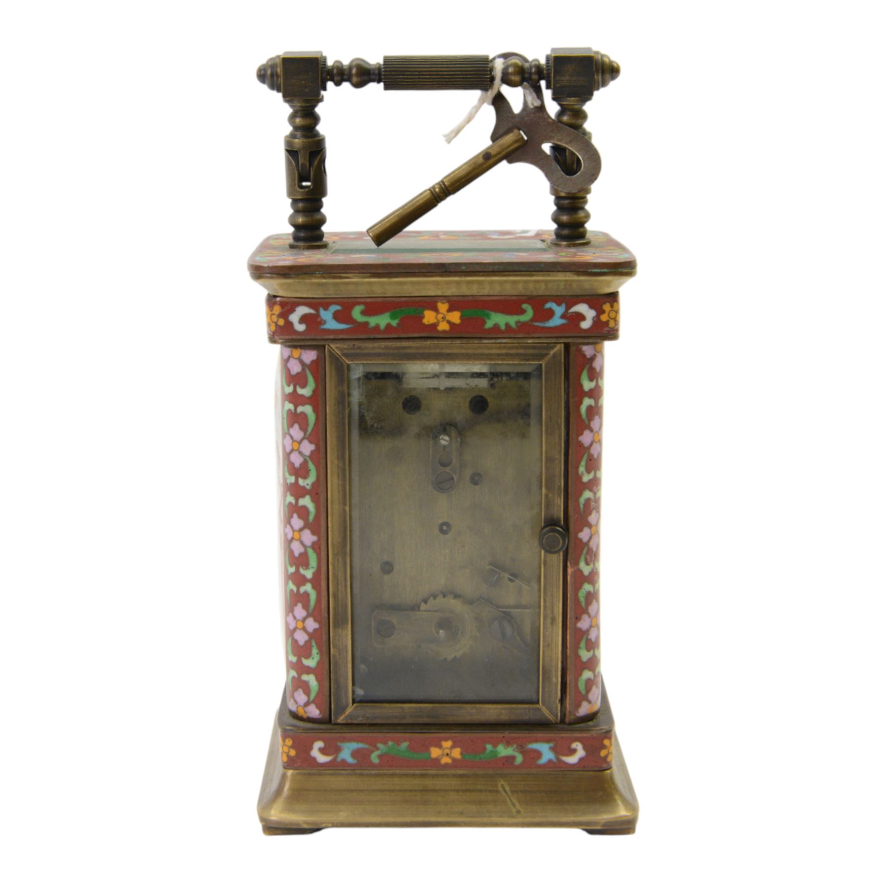 Late 20th century- Chinese 8-day timepiece carriage clock with Cloisonne work on a red ground to the four pillars, base and cornice, with painted porcelain panels to the sides, white enamel dial with Roman numerals and trefoil steel hands, platform escapement wound and set from the rear. With Key.