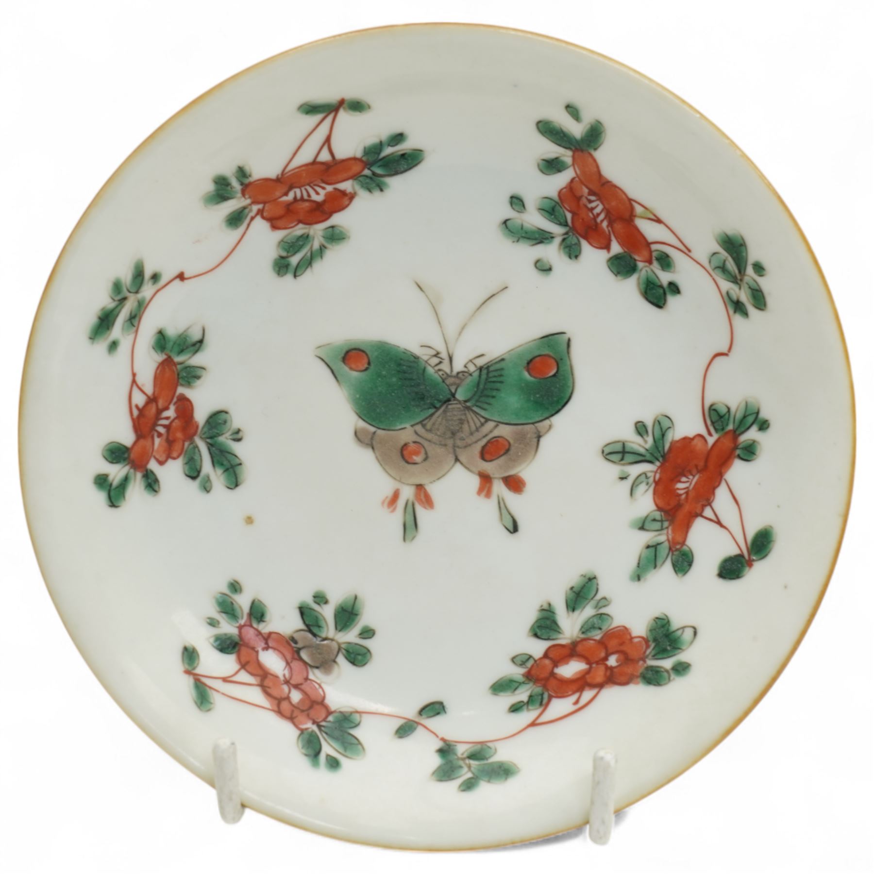 Three Chinese famille verte examples, approximately Yongzheng period, to include two teabowls and two saucers, each decorated with flowers and butterflies, two with sacred fungus mark within double rings, the teabowl with lotus mark, the other indistinct - possibly a Wan mark within lozenge (4)