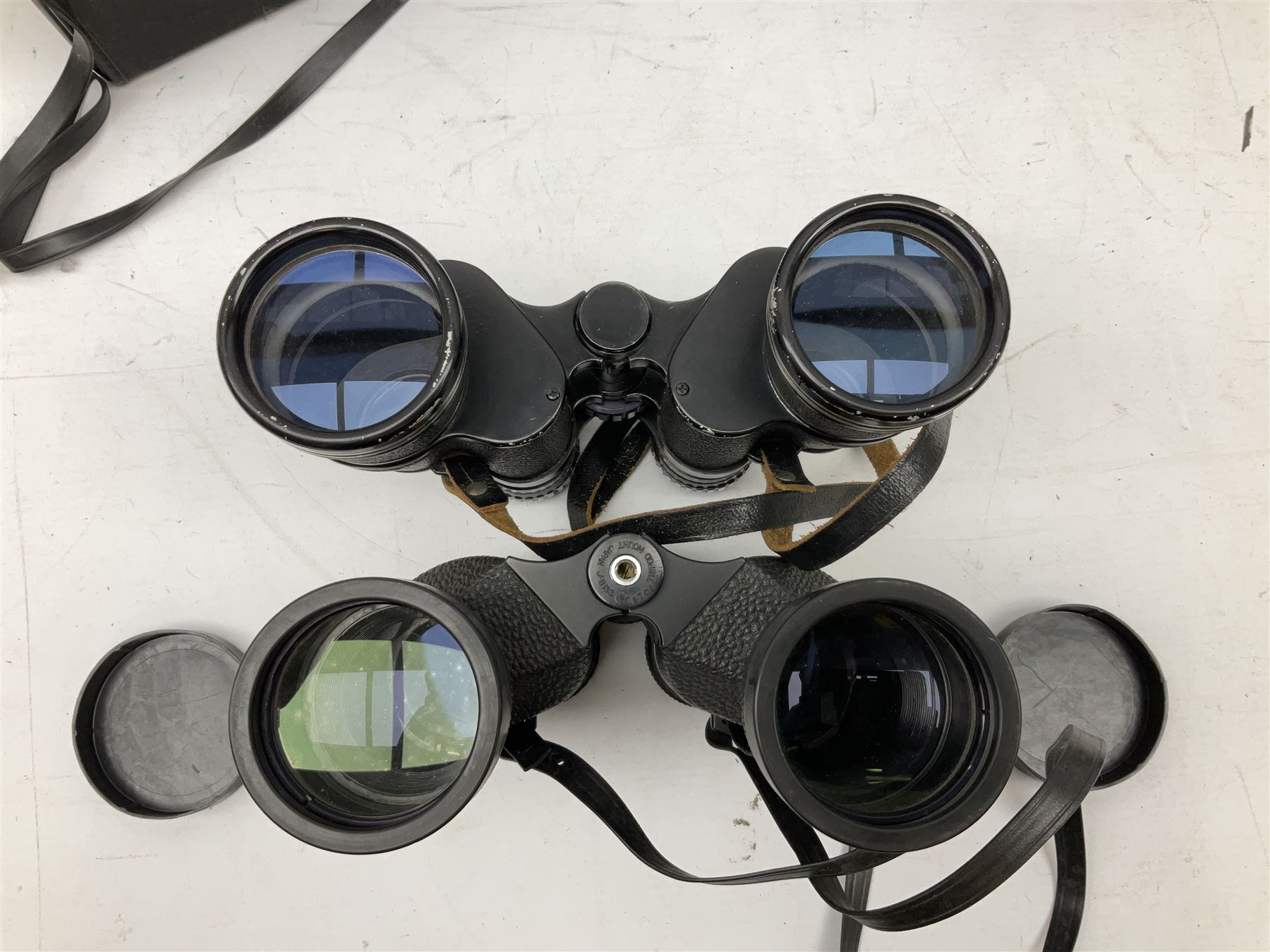 Eleven cased pairs of binoculars, to include Omiya 8x30, Tasco, Esde-Optik 8x40 Weitwinkel, Chinon 10x50 Field. Aico Rapide 8x30, Astralite zoom 6x- 14x32, etc