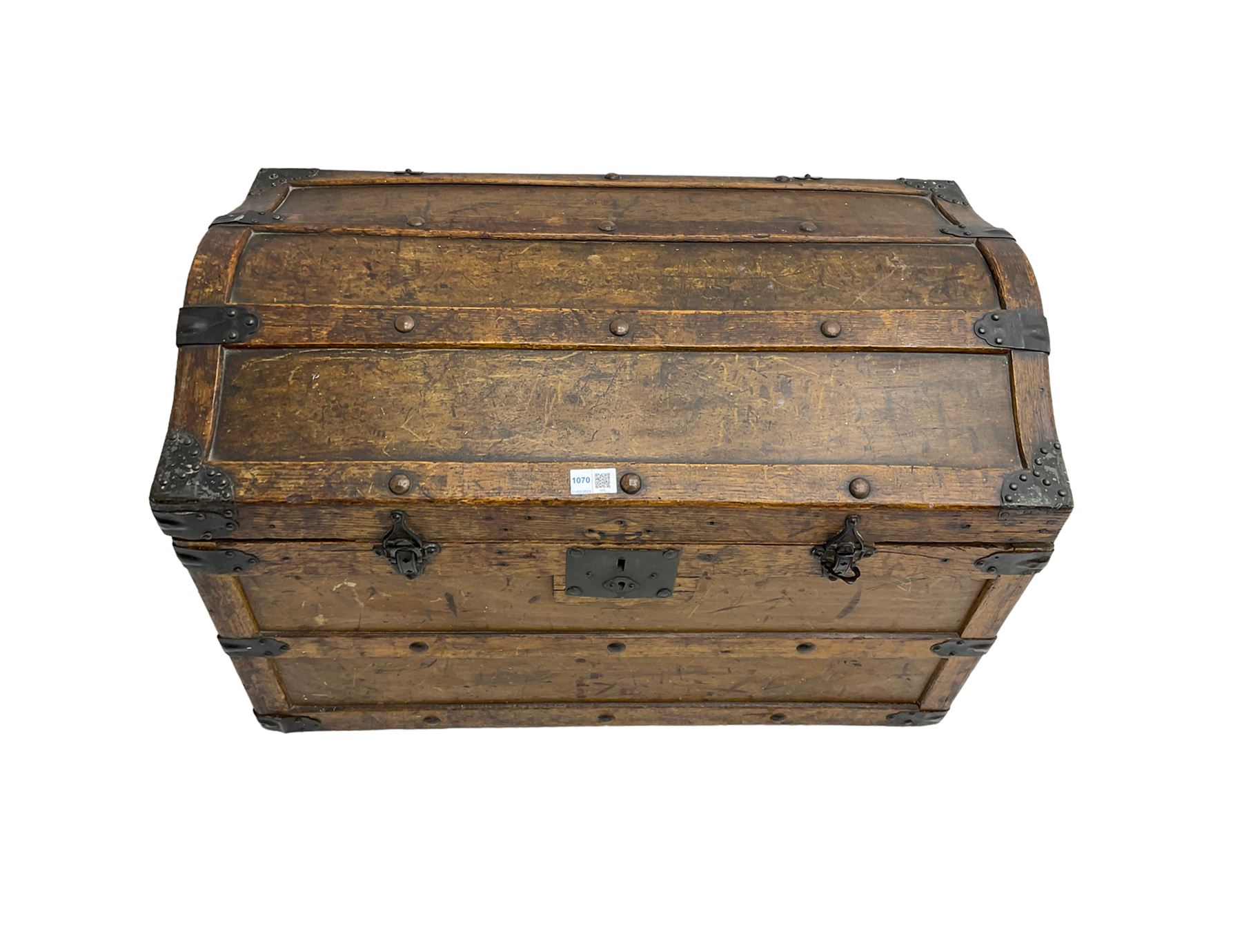 Late 19th to early 20th century oak framed travelling trunk, dome top with iron fittings and panelled sides and top, interior labelled 'The Anchor Patent Waterproof Travelling Trunk - 1902'