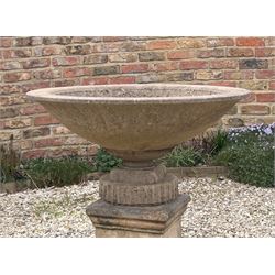 Reconstituted stone shallow urn / bowl planter, raised on a scrolled and fluted base. H43cm, D87cm. - COLLECTION BY APPOINTMENT FROM: The White House, Thirsk Road, Easingwold, York, YO61 3NF - CALL 01723 507111 TO ARRANGE