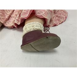 Reproduction Simon & Halbig bisque head doll with applied hair and jointed limbs; marked Simon & Halbig 117, H58cm