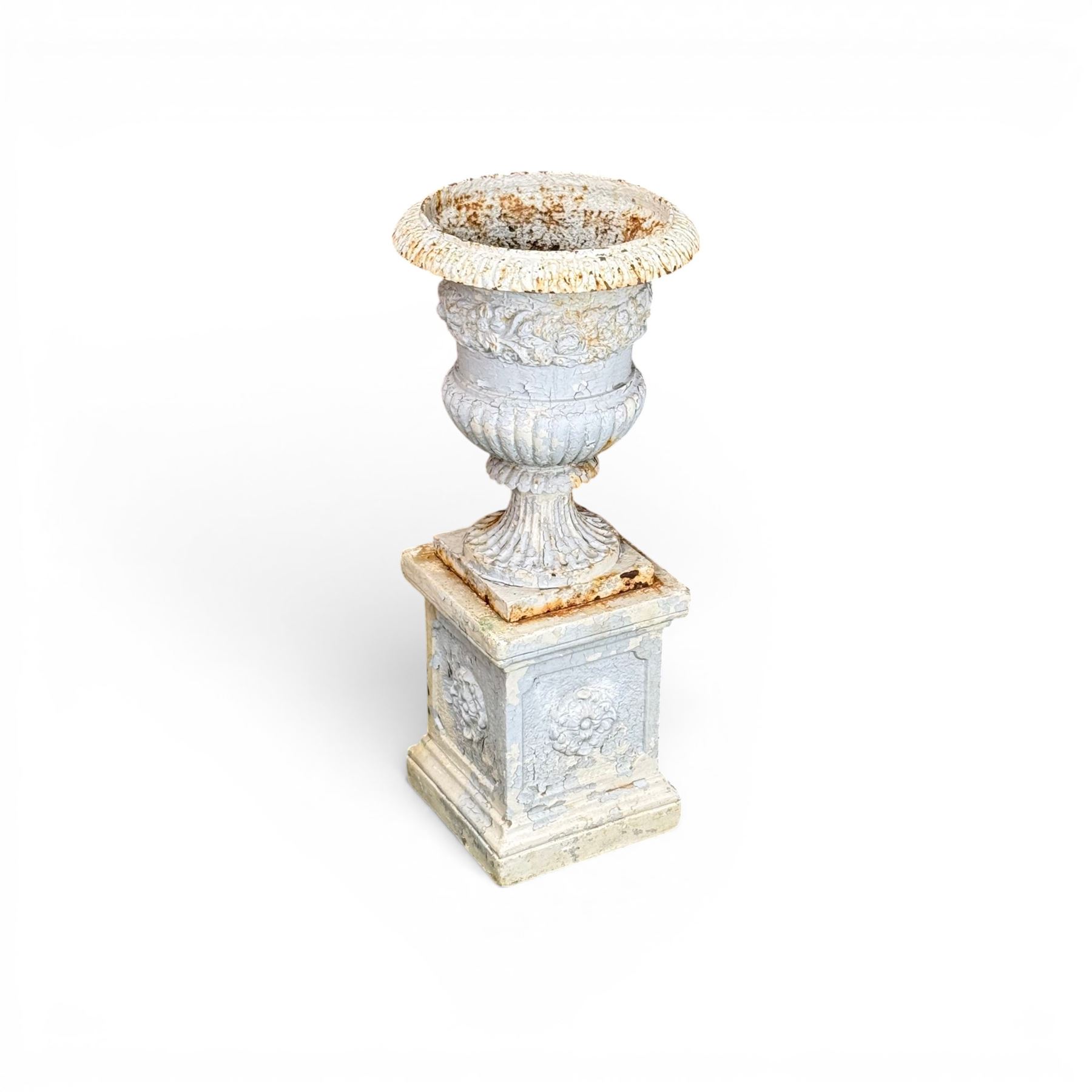 Victorian weathered heavy ornate cast iron garden centerpiece urn, distressed white and duck egg blue painted, raised on square plinth with rose detail 