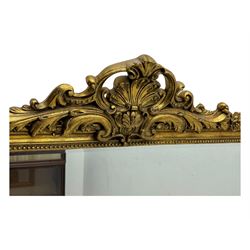 18th century design ornate gilt framed overmantle mirror, bevelled mirror plate within arched frame with pierced pediment featuring foliate and scrollwork designs