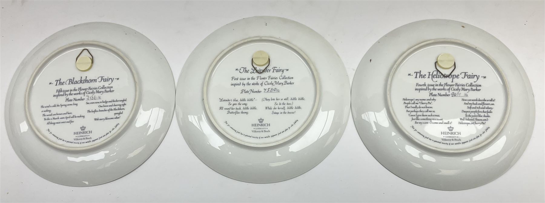 Four Royal Doulton Images figures comprising 'Happy Anniversary', 'Wedding Day', 'Congratulations' and 'Carefree', together with a set of three Heinrich collectors plates depicting Fairies.