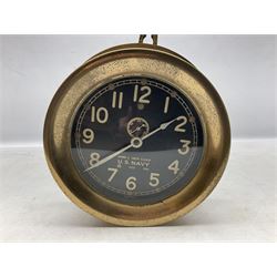 WWII period US Navy Mark I deck clock, the black circular dial with Arabic numerals,  luminous dot markers and subsidiary seconds dial marked 'Mark I Deck Clock U.S. Navy 15211 1941', in bronze bulk head case D20cm; and a Loose-Wiles Biscuit Company octagonal tin decorated with nine different US Warships (2)