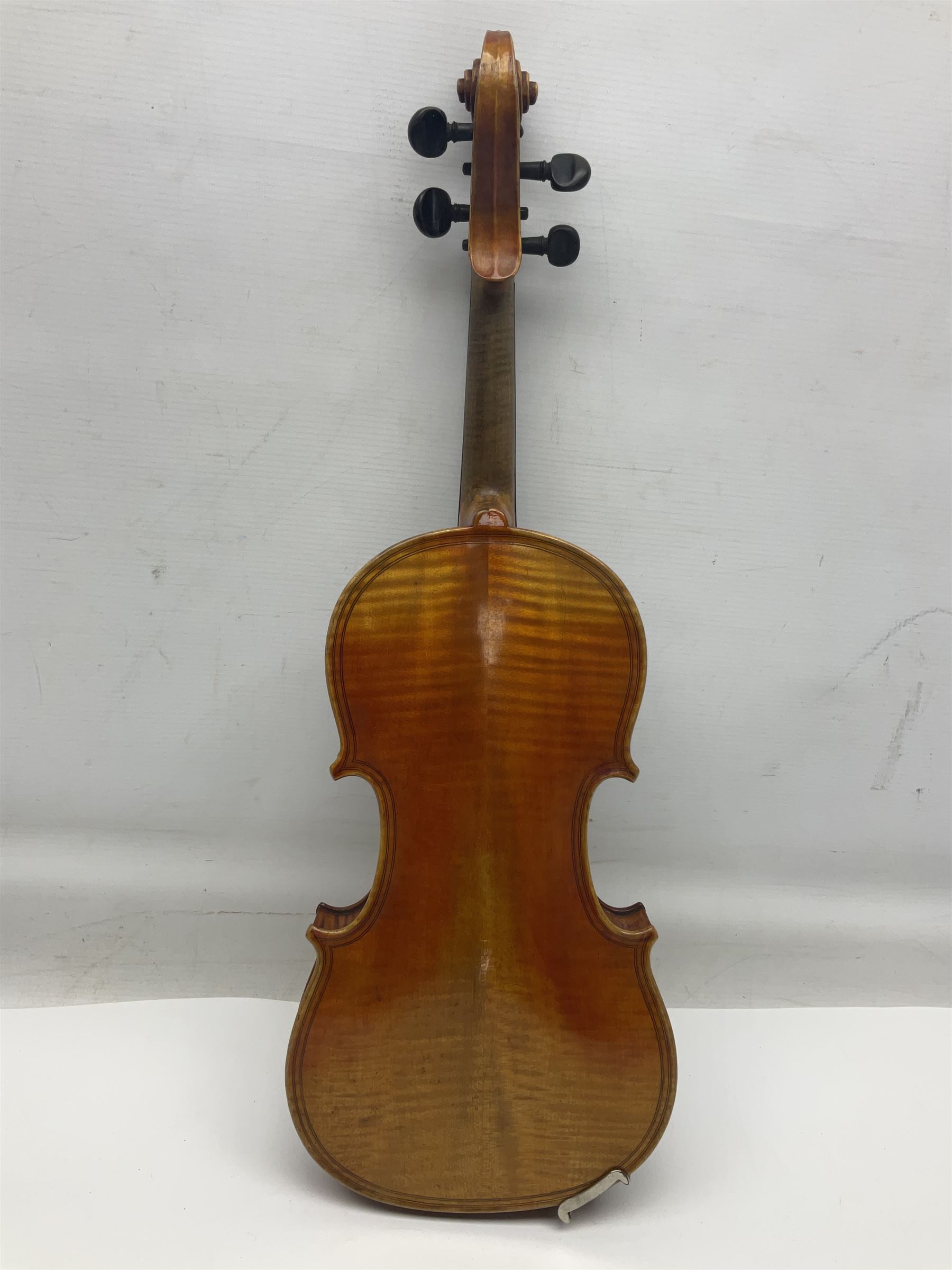 German trade violin c1900 copy of a Maggini with 36.5cm two-piece maple back and ribs and spruce top; double scroll; L60cm overall; in carrying case