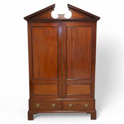 George III mahogany wardrobe, broken sloped arch pediment with dentil moulding over two panelled doors, the base fitted with two cock-beaded drawers, on bracket feet, knock-down construction 