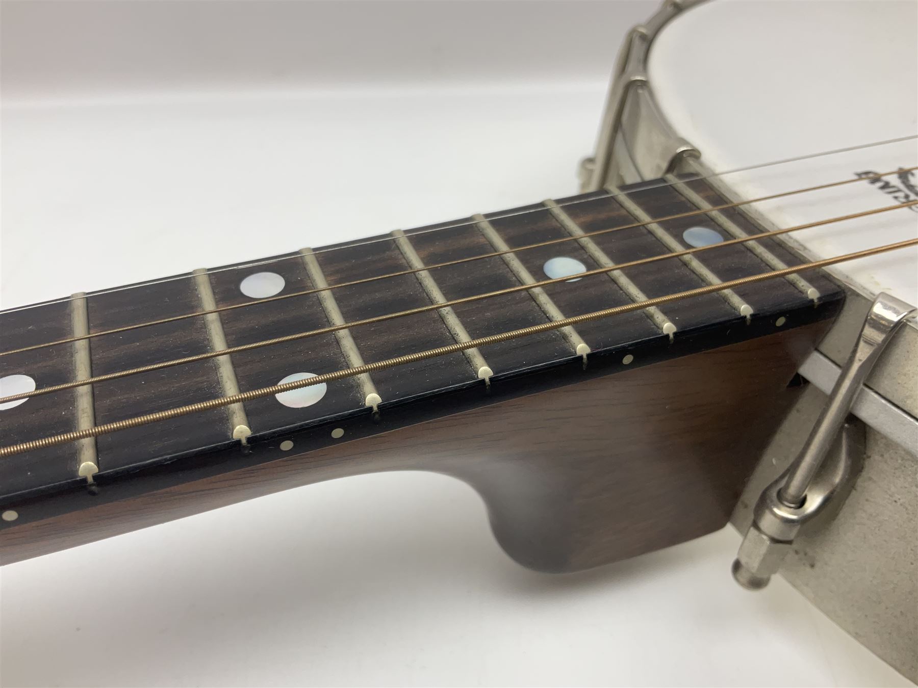 Deering seventeen-fret tenor banjo with cast metal body, serial no.H275, L79cm overall; in fitted hard carrying case