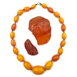  Butterscotch amber bead necklace and two amber pieces  