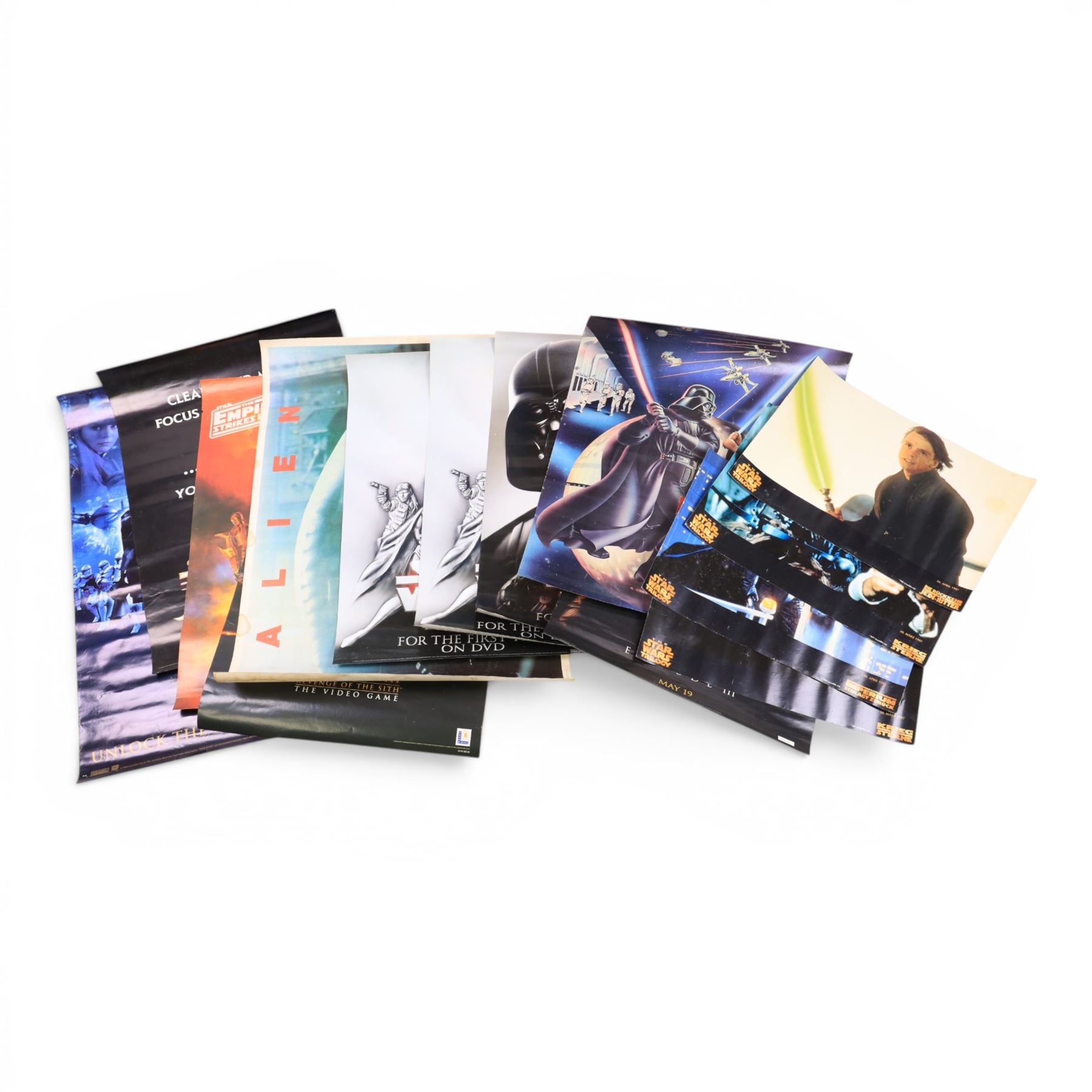 Collection of Star Wars posters, including two vintage 1970s/80s examples, PlayStation, Pepsi, door posters, special edition three film door scroll posters, DVD posters, Storm Trooper door poster, etc, vintage Alien poster and two framed Star Wars Heroes and Villains playing card posters