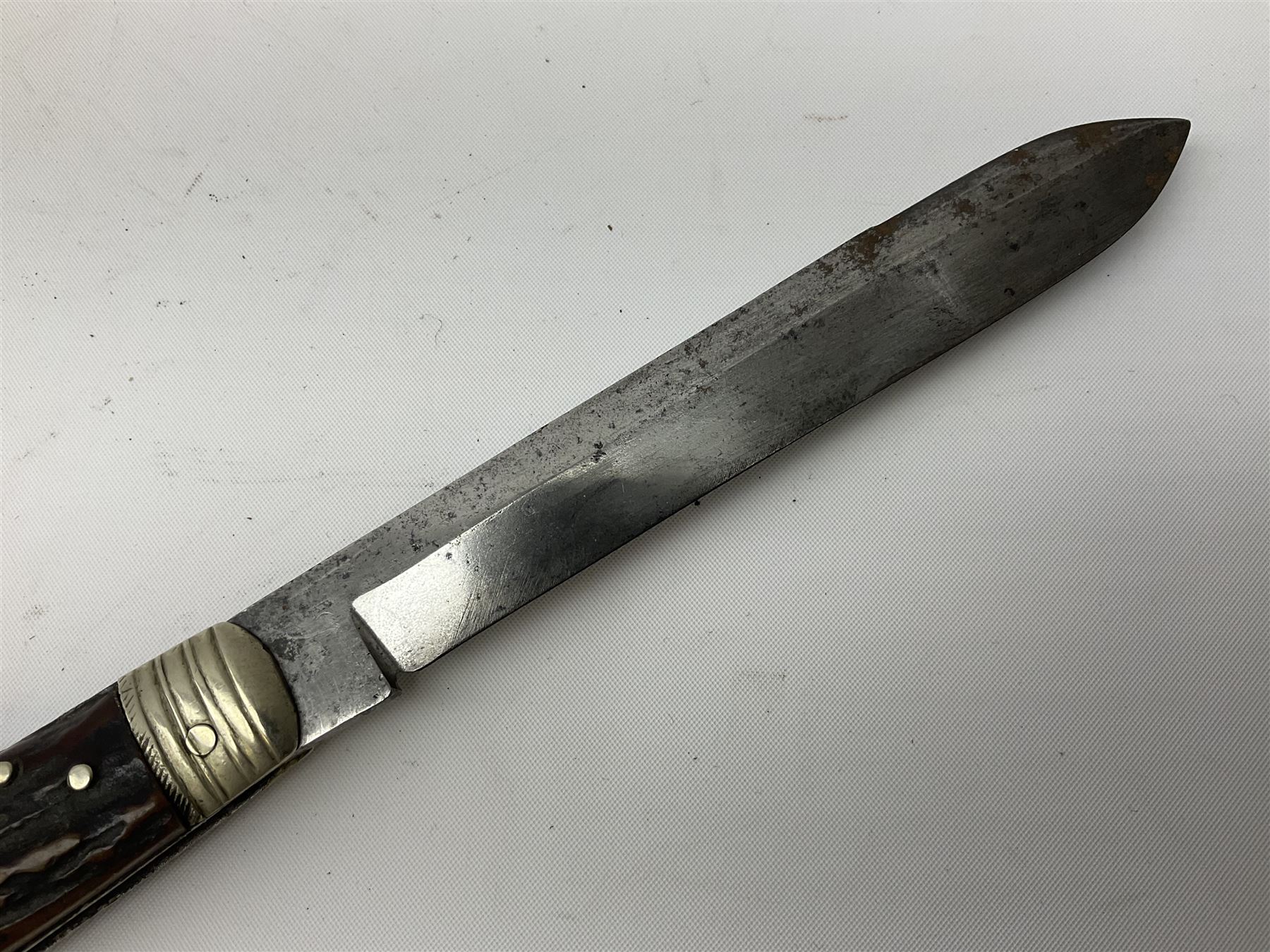 Hunting knife by J Nowill & Sons, Sheffield, the handle inset with mother of pearl, blade length 19cm; George Wolstenholme IXL lock-knife with antler scales L29cm open; and another Bowie style hunting knife marked 'V.R. Warranted Sheffield Joseph Ellis & Sons' in leather sheath (3)
