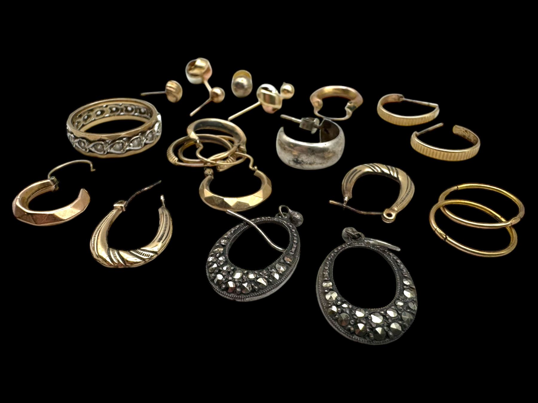 9ct gold earrings, including hoop earrings and knot earrings, together with a 9ct gold paste set eternity ring and a pair of silver marcasite earrings 