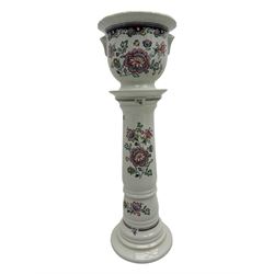 Royal Winton - early 20th century ceramic jardinière on stand, white ground with polychrome floral decoration, flared rim and twin handles, on circular base