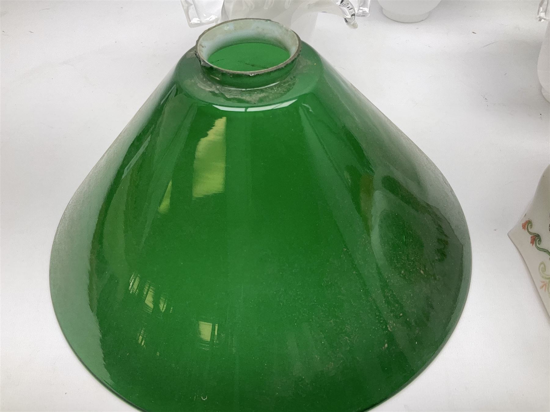 Milk glass lampshade decorated with peacocks, together with a Tiffany style lampshade, a set of five white frilled lamps shades etc 