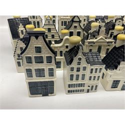 Twenty seven KLM Bols Blue Delft's decanters in the form of Dutch houses, some with contents