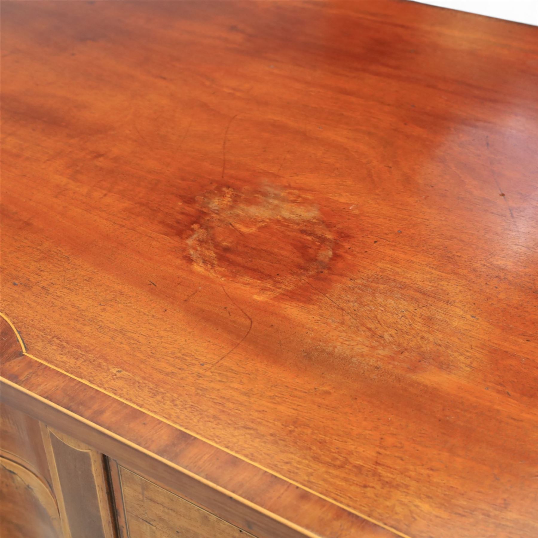 George III Sheraton design serpentine inlaid mahogany and satinwood sideboard