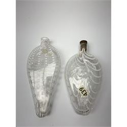 19th century Nailsea glass flask of compressed ovoid form, the clear body with opaque white combed decoration, H21cm, together with another similar example decorated with enamelled stylised bands, H23cm