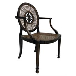 Mid-to late 20th century walnut Hepplewhite design elbow chair, circular cane back with pierced and carved central rosette, fluted frame with scrolling arms, cane seat raised on fluted rail and square tapering supports with spade feet