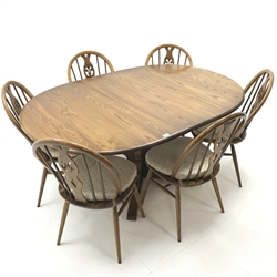 Ercol elm Old Colonial extending pedestal dining table with single leaf (W115cm and 165cm, H73cm, D115cm) and set six hoop back dining chairs (W43cm) 