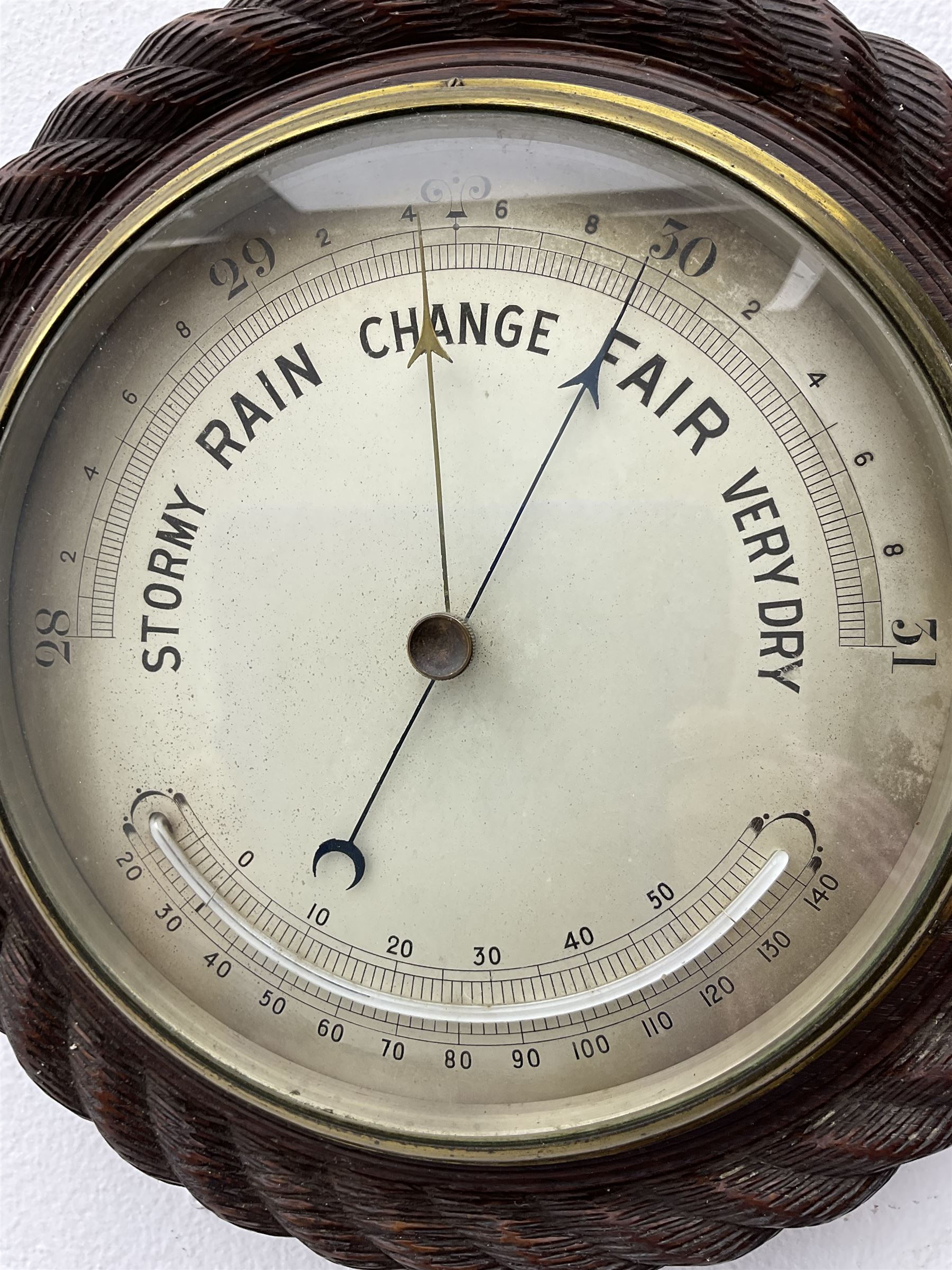 Edwardian - 8-day ships bulkhead clock and an Aneroid barometer.
In matching circular oak cases with carved rope twist bezels.
Clock with a painted metal dial, Roman numerals, minute track and steel spade hands, small seconds hand and platform regulation. Case 9