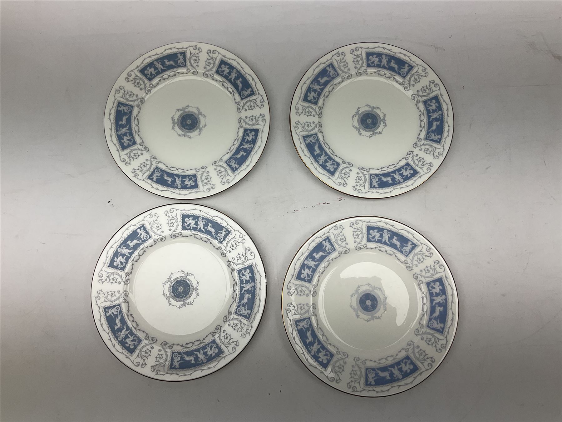 Coalport Revelry pattern tea and dinner wares, comprising nine dinner plates, four salad plates, eleven side plates, sauce boat and stand, ten teacups and ten saucers, and preserve pot and cover, together with a Coalport plate of shaped form decorated with pink roses, and a Royal Crown Derby Royal Antoinette pattern trio