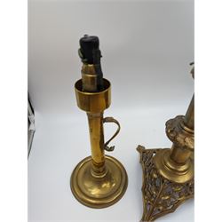 Brass candlestick with a knopt stems and triform base, together with two other brass candlestick 