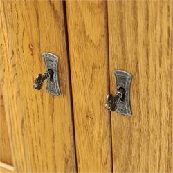 Old Charm - 'Chatsworth' light oak bookcase with two cupboards, featuring two fixed horizontal shelves forming six  rectangular open compartments, over twin panelled cupboard doors, chamfered uprights and plinth base