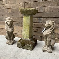 Pair of cast stone seated garden lions, a stone bird bath and various pots and planters
